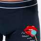  Black Boxer shorts printed with an image of lips and tongue licking a blue lolly  with the words I've licked it so it's mine