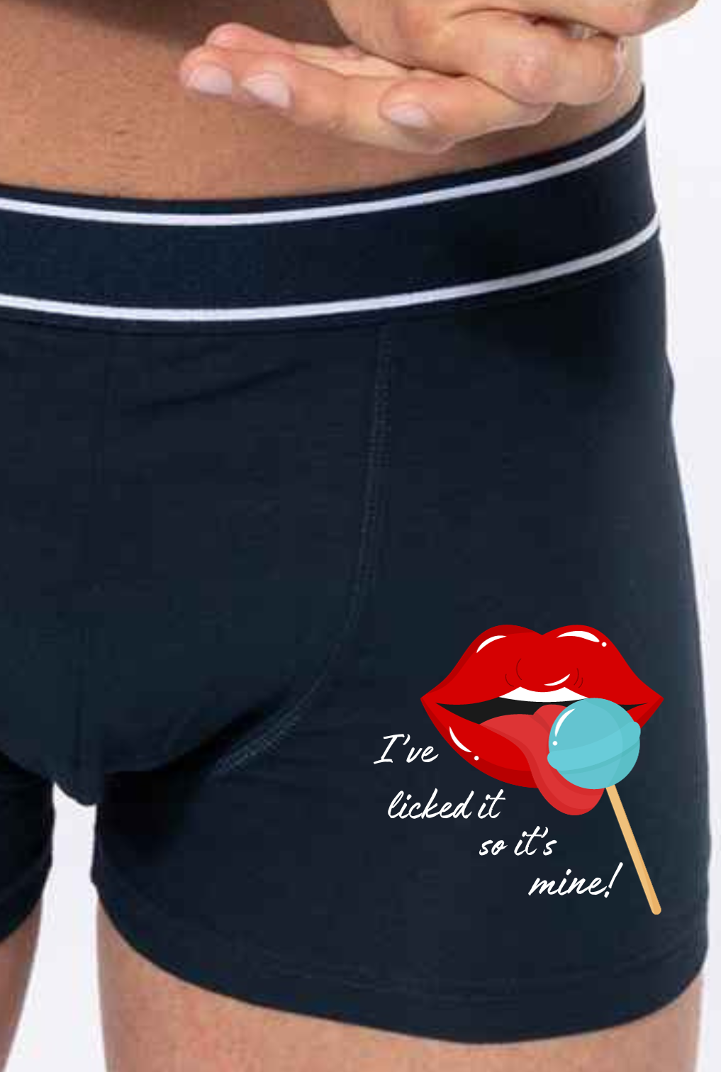  Black Boxer shorts printed with an image of lips and tongue licking a blue lolly  with the words I've licked it so it's mine