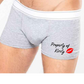 Grey boxer shorts printed with an image of lips and the words property of, followed by a name