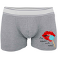 Grey boxer shorts with a white contrasting waist band. Printed with an image of lips and tongue licking a blue lolly  with the words I've licked it so it's mine