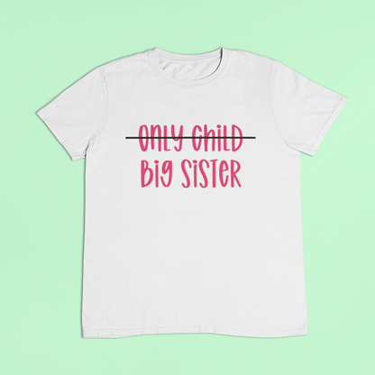 White t-shirt with pink text. First line says only child with this crossed out and the words big sister replaced below