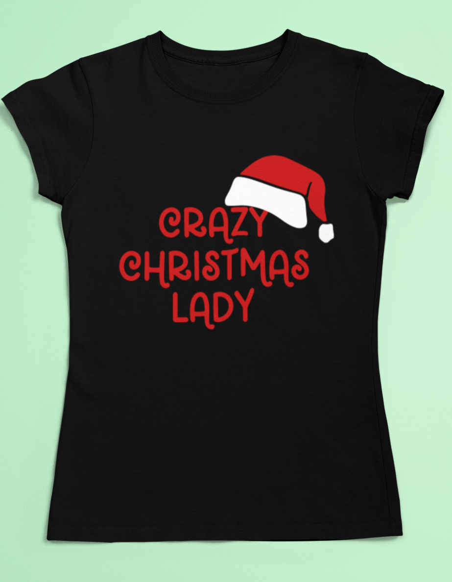 Black t-shirt with the slogan "crazy Christmas lady" in red with a Santa hat placed on the top right hand side on the text 